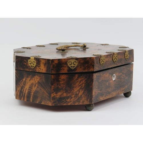 16 - A French musical sewing box, 19th century. Of elongated octagonal form, the hinged cover opening to ... 