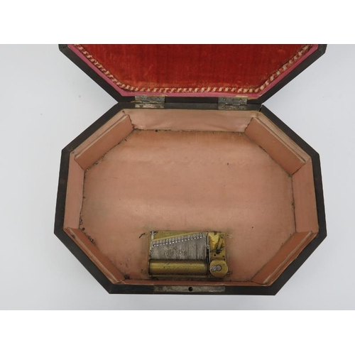 16 - A French musical sewing box, 19th century. Of elongated octagonal form, the hinged cover opening to ... 