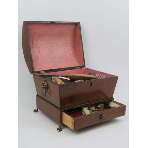 17 - A Regency box strung mahogany sewing box. Of sarcophagus form with a hinged cover, lower external dr... 