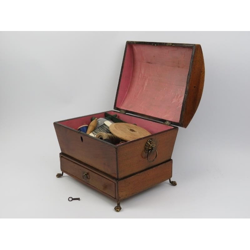 17 - A Regency box strung mahogany sewing box. Of sarcophagus form with a hinged cover, lower external dr... 