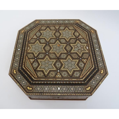 20 - A large Islamic parquetry inlaid wood, ivorine and mother of pearl box, 20th century. Of octagonal f... 