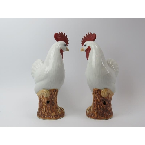 25 - A pair of Chinese porcelain roosters, early 20th century. Hand painted with sgraffito detail to the ... 