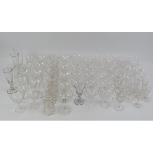 259 - A group of sixty clear glass drinking glasses. (60 items) tallest height. 
Condition report: The maj... 