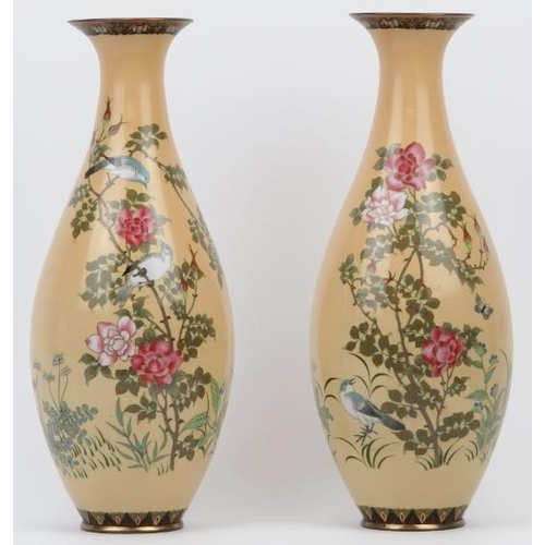 261 - A pair of Japanese cloisonné enamelled vases, late Meiji period. Decorated with birds amongst flower... 