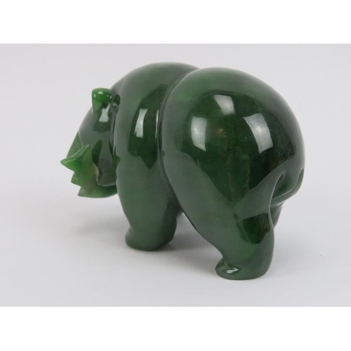 272 - A Canadian carved jade bear with salmon in mouth, 20th century. 8.8 cm length. 
Condition report: Li... 