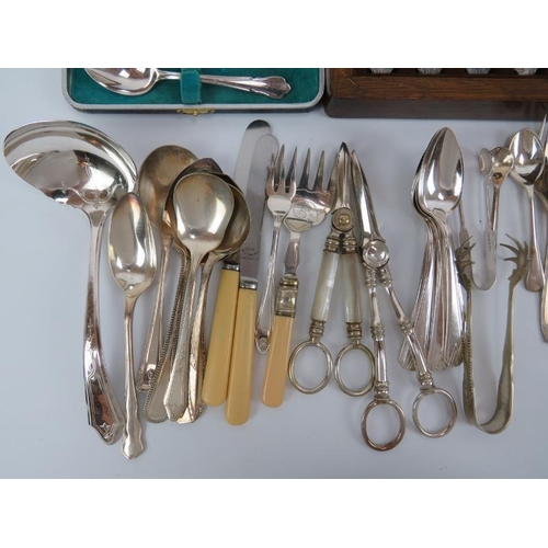 279 - A group of plated silver flatware and utensils. Notable makers included Mappin & Webb and Tudor. (Qu... 