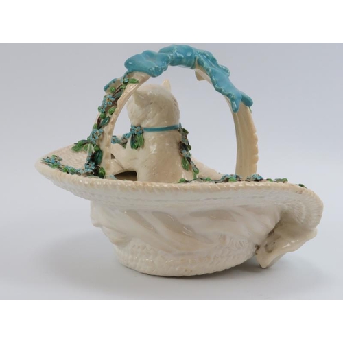 37 - A Victorian ceramic bowl modelled as figure of a cat in a straw hat. Modelled with a a swing handle ... 