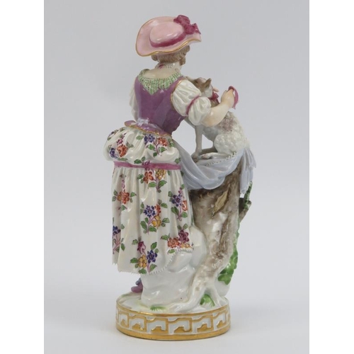 38 - A Meissen hand painted porcelain figure of a shepherdess, 19th century. Factory marks beneath. 18.5 ... 