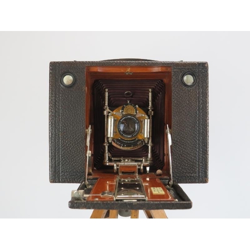 47 - An Eastman Kodak concertina camera with Bausch & Lomb lens, early 20th century. Tripod stand include... 