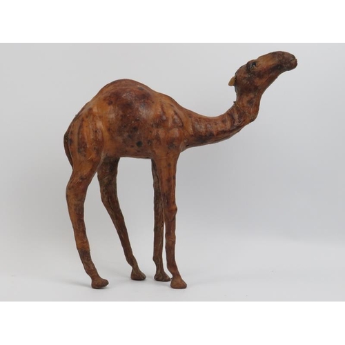 49 - A vintage Liberty style brown leather model of a camel, early 20th century. 33 cm height. Condition ... 