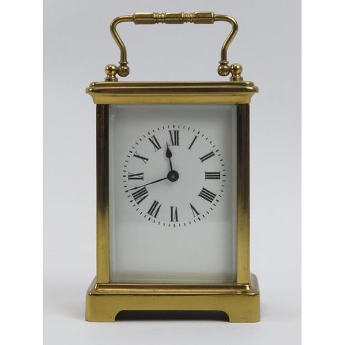 52 - A French brass carriage clock, 20th century.  With white enamelled dial and Roman numerals. Key incl... 