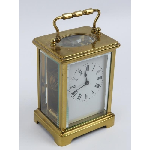 52 - A French brass carriage clock, 20th century.  With white enamelled dial and Roman numerals. Key incl... 