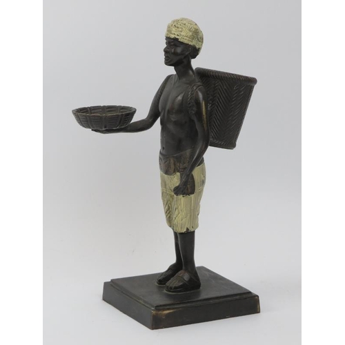 57 - A hand painted bronzed matchstick holder modelled as an Arabian figure, early/mid 20th century. 25.6... 