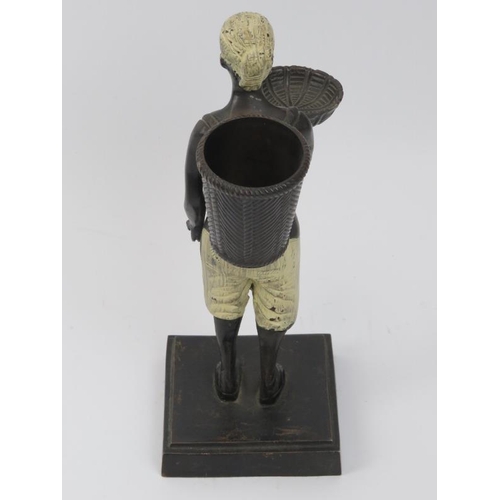 57 - A hand painted bronzed matchstick holder modelled as an Arabian figure, early/mid 20th century. 25.6... 