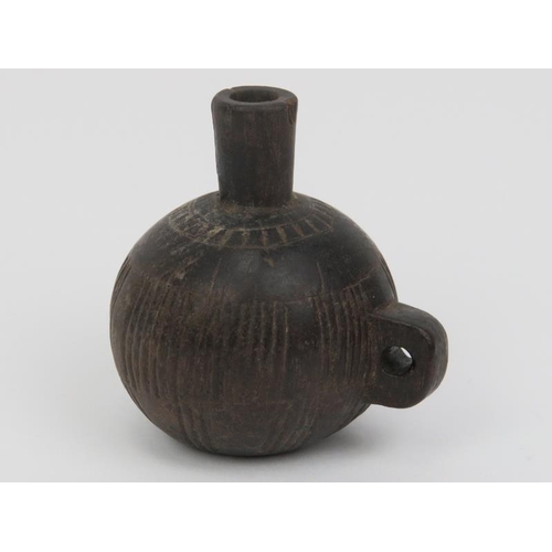 70 - Tribal Art: An African snuff container, Kuba Kingdom, Congo, 19th century. Carved in wood, of bottle... 