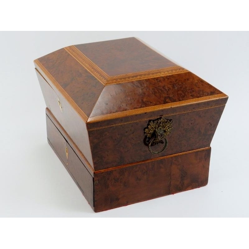 82 - A box strung burr walnut sewing box, 19th century. Of sarcophagus form with gilt metal acorn handles... 