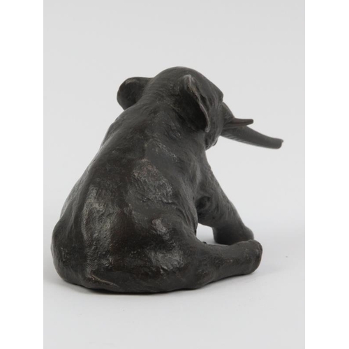 91 - A bronze sculptural study of a recumbent elephant, 20th century. 14 cm length. Foundry mark beneath.... 