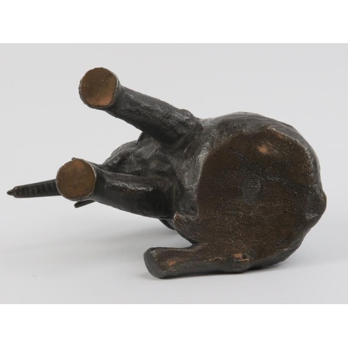 91 - A bronze sculptural study of a recumbent elephant, 20th century. 14 cm length. Foundry mark beneath.... 