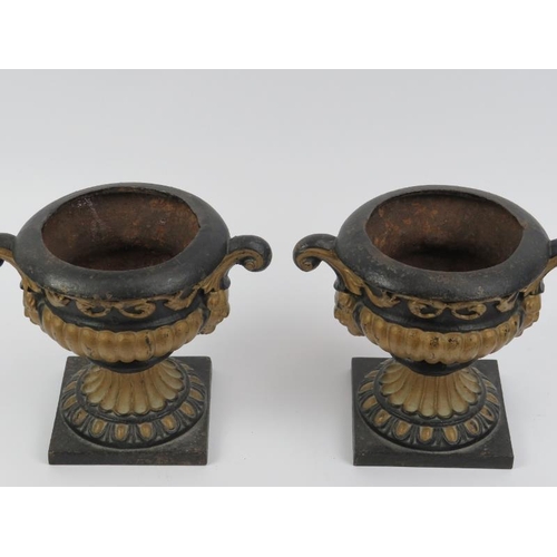 96 - A pair of Victorian painted cast iron urns with covers. 21 cm height. Condition report: Some age rel... 