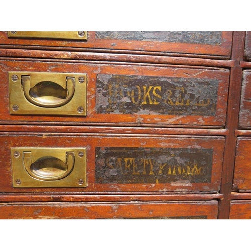 701 - A 19th Century mahogany haberdashery bank of 24 drawers, having brass campaign style handles and han... 