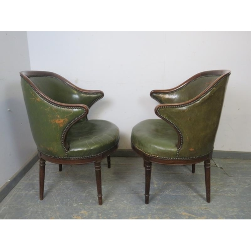 710 - A pair of antique mahogany library tub chairs, upholstered in distressed green leather with brass st... 