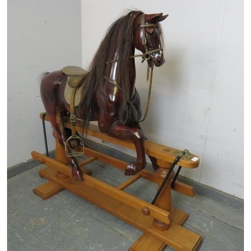 726 - A fine quality bespoke mahogany 44” rocking horse by Harold Wakefield of Boston, fitted with leather... 