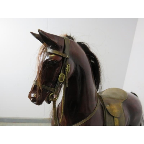 726 - A fine quality bespoke mahogany 44” rocking horse by Harold Wakefield of Boston, fitted with leather... 