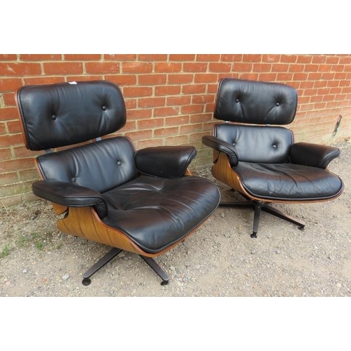 731 - A pair of mid-century style Eames lounge chairs, the bent plywood seats upholstered in supple button... 