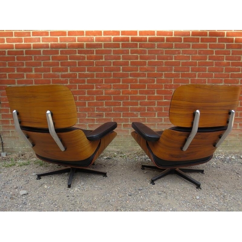 731 - A pair of mid-century style Eames lounge chairs, the bent plywood seats upholstered in supple button... 