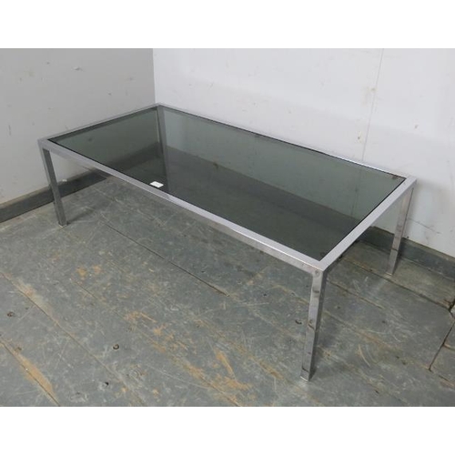 734 - A mid-century low rectangular chrome and smoked glass coffee table, on square supports. c1970.  
H39... 