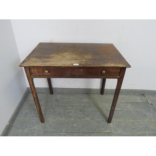 744 - A Georgian oak side table, the one long drawer with brass knob handles, on inner chamfered square su... 