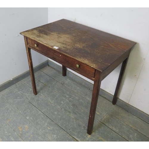 744 - A Georgian oak side table, the one long drawer with brass knob handles, on inner chamfered square su... 