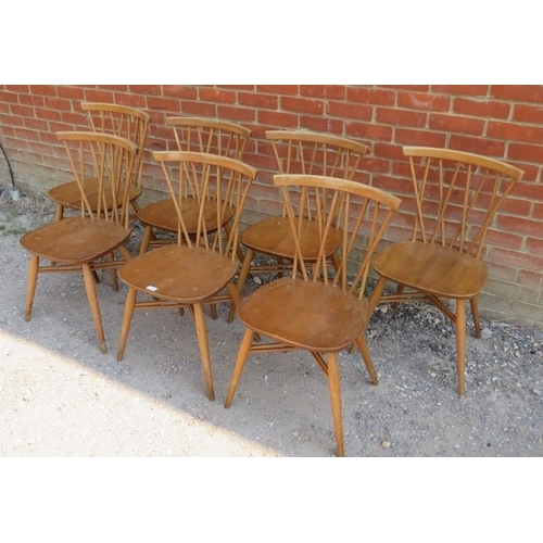 752 - Seven mid-century blonde elm and beech ‘candlestick’ dining chairs by Ercol, the lattice backs above... 