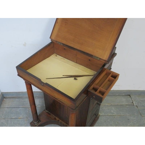 761 - A 19th century rosewood Davenport, the ¾ gallery above a leather-bound writing slope opening onto a ... 