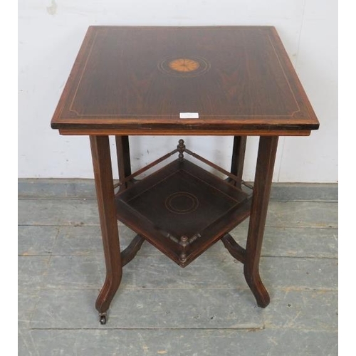 762 - An Edwardian rosewood two-tier occasional table, crossbanded in walnut and strung with boxwood and e... 