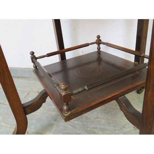 762 - An Edwardian rosewood two-tier occasional table, crossbanded in walnut and strung with boxwood and e... 