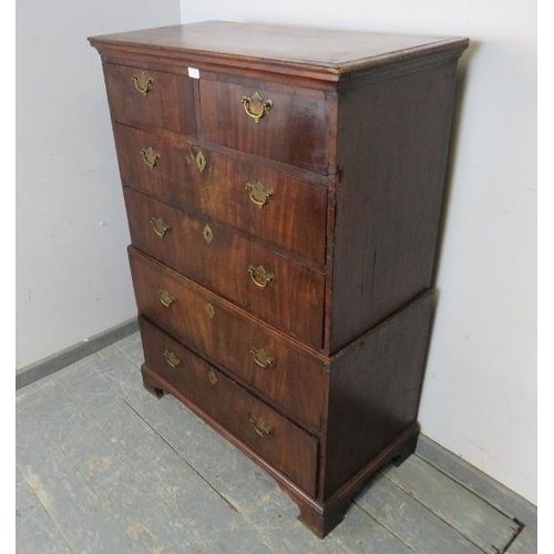 766 - An early 18th century mahogany chest on chest of small proportions, having two short above four long... 