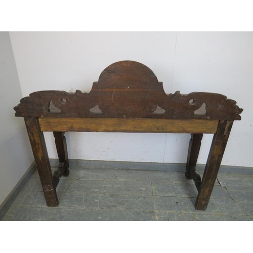 768 - A 19th century Gothic Revival oak console table, the carved and pierced gallery with central grotesq... 