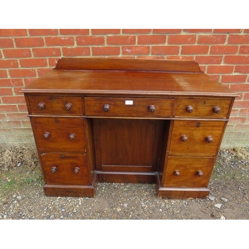 777 - A 19th century mahogany kneehole desk, housing a configuration of seven graduated drawers retaining ... 