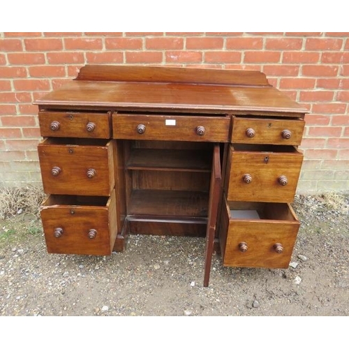 777 - A 19th century mahogany kneehole desk, housing a configuration of seven graduated drawers retaining ... 