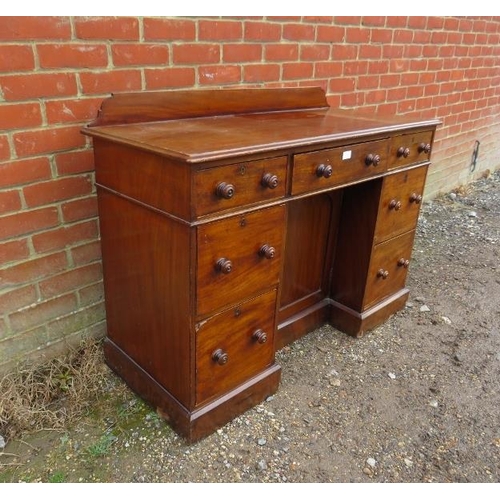 777 - A 19th century mahogany kneehole desk, housing a configuration of seven graduated drawers retaining ... 