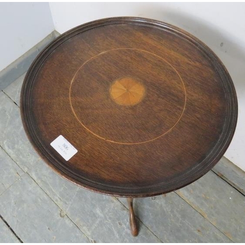 806 - A Georgian Revival mahogany wine table, the dished top with batwing central roundel, on a turned ped... 