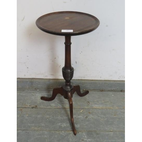 807 - A small Georgian Revival mahogany wine table, the dished top on a turned column with tripod supports... 