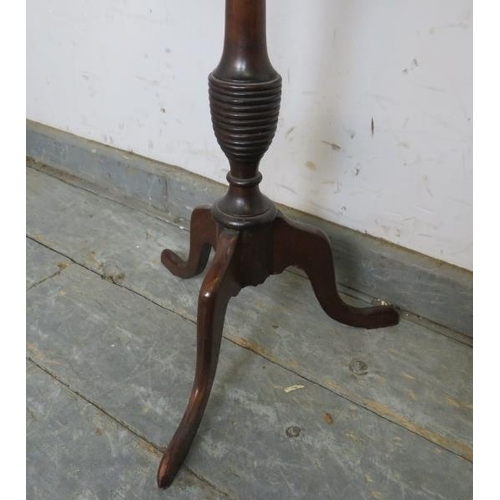 807 - A small Georgian Revival mahogany wine table, the dished top on a turned column with tripod supports... 