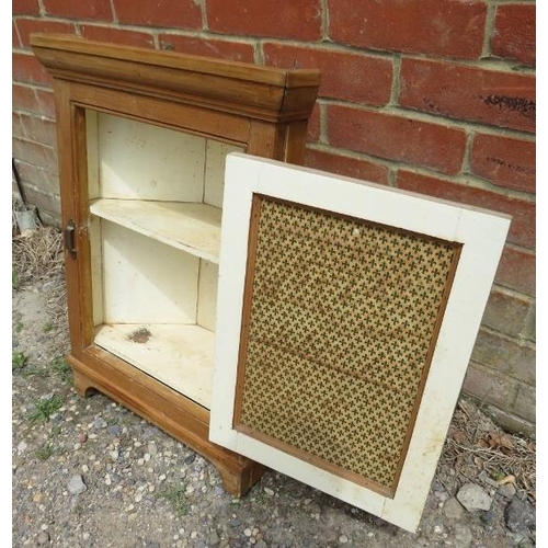 809 - An antique pine hanging corner cupboard, the door with inset mirror and brass latch opening onto a p... 