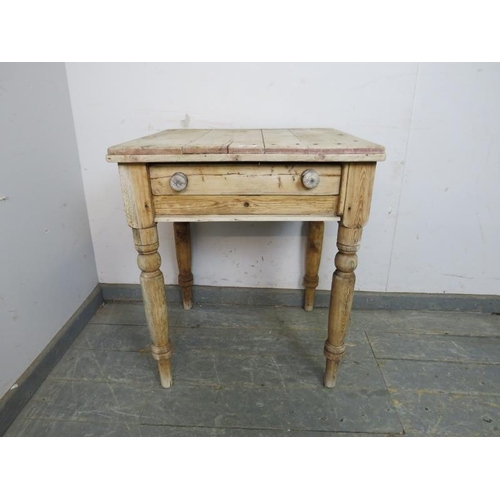 812 - A scrubbed antique pine kitchen table, having one long drawer, on turned and tapered supports. 
H70c... 