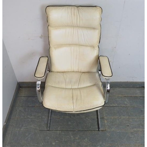 819 - A mid-century chrome desk chair in the manner of Pieff, upholstered in ivory leather with black pipi... 