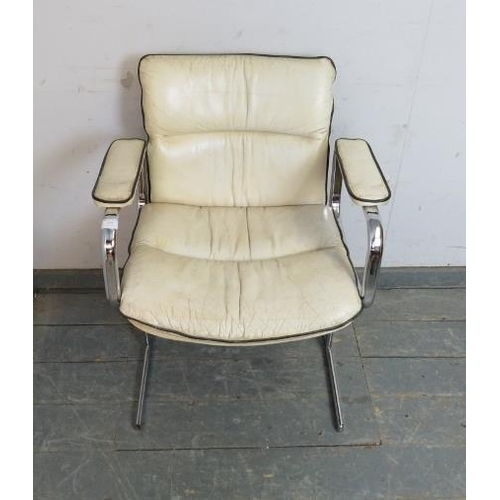 820 - A mid-century chrome desk chair in the manner of Pieff, upholstered in ivory leather with black pipi... 