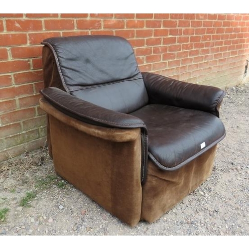 821 - A mid-century ranch style club armchair upholstered in hand-stitched brown buffalo leather and suede... 