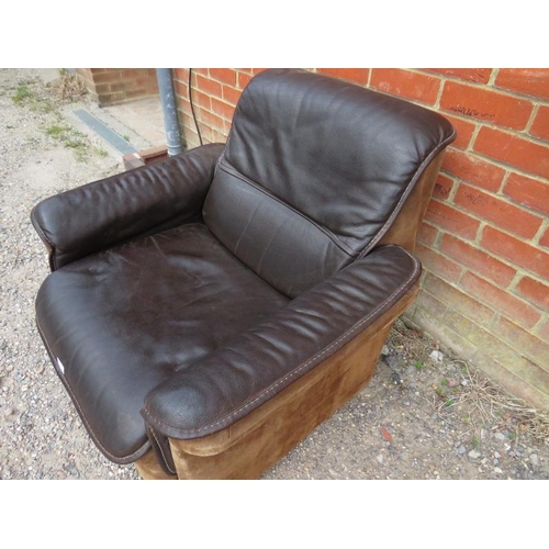 821 - A mid-century ranch style club armchair upholstered in hand-stitched brown buffalo leather and suede... 